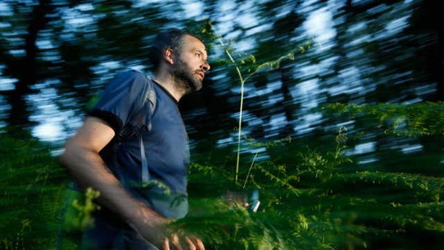 man running in wilderness
