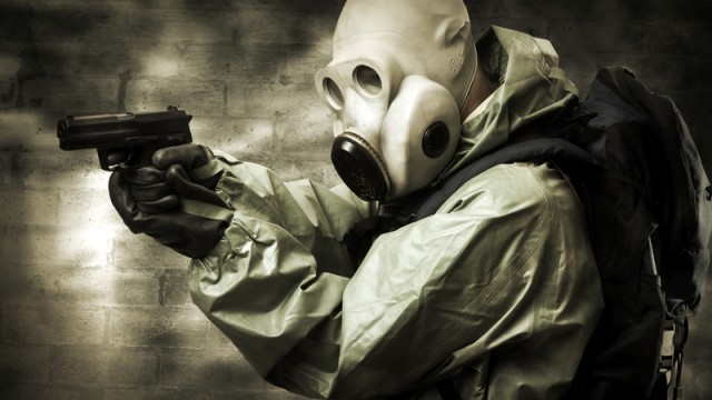 Man with gas mask and gun