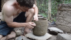 using clay to make a pot