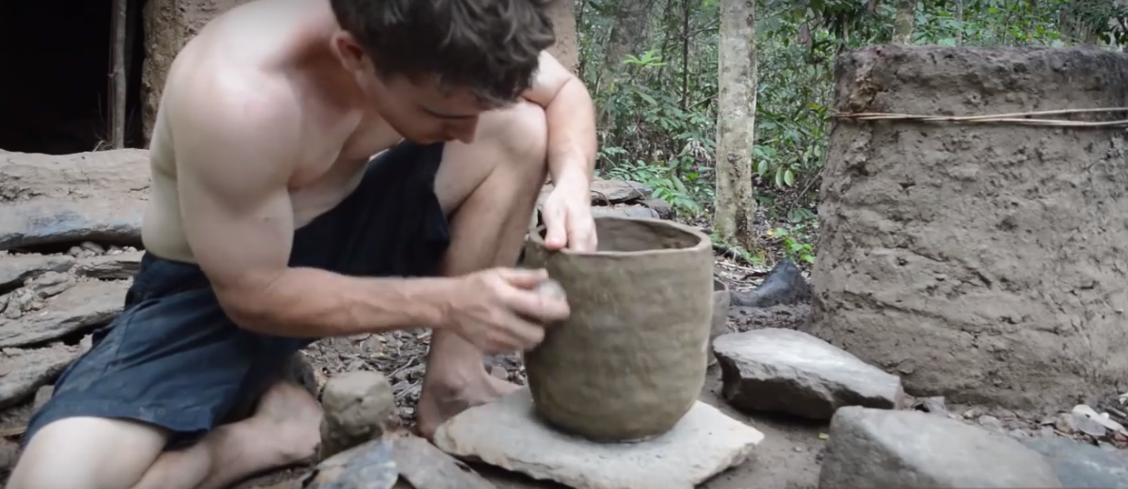 using clay to make a pot