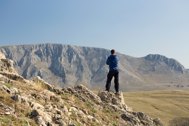 man standing on mountain