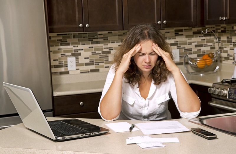 frustrated woman in debt