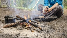 guy sitting by the fire