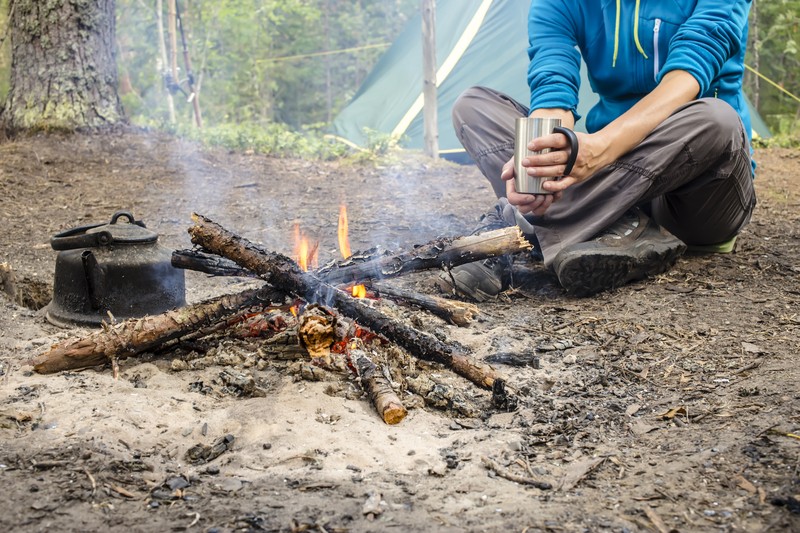 guy sitting by the fire