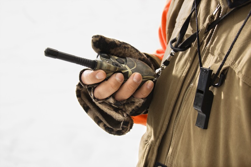 man holding a walkie talkie