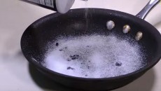 pouring salt on a pan