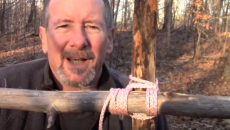 man tying a square lashing