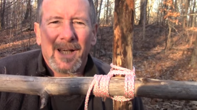 man tying a square lashing