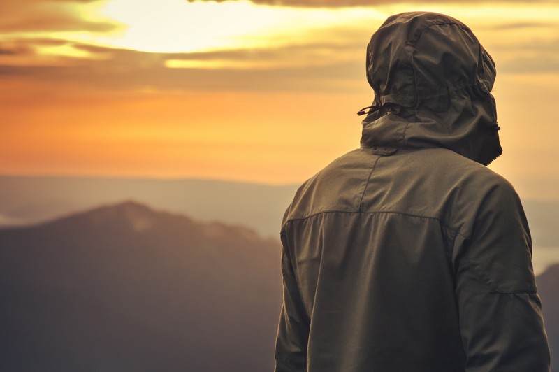 man standing alone outdoors