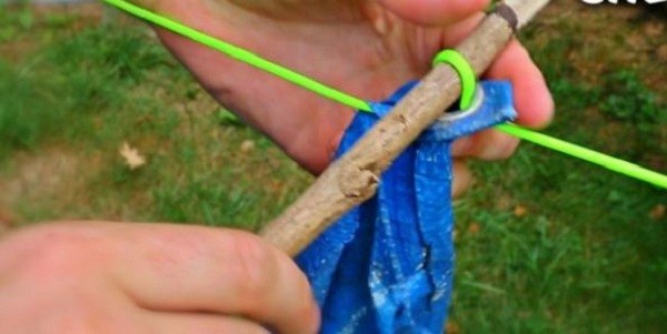 setting up a shelter tarp