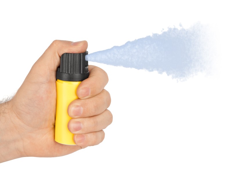 hand with pepper spray