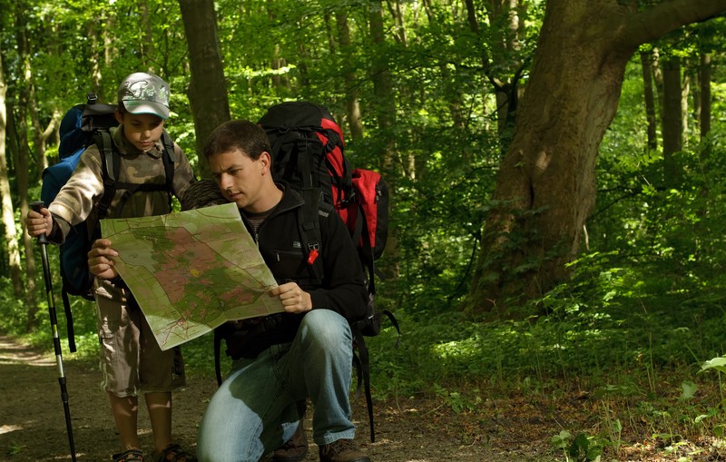 father and son bugging out in forest