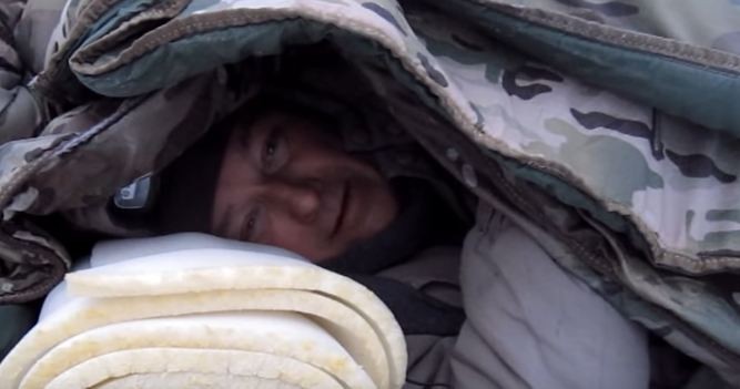 man-surviving-in-blankets