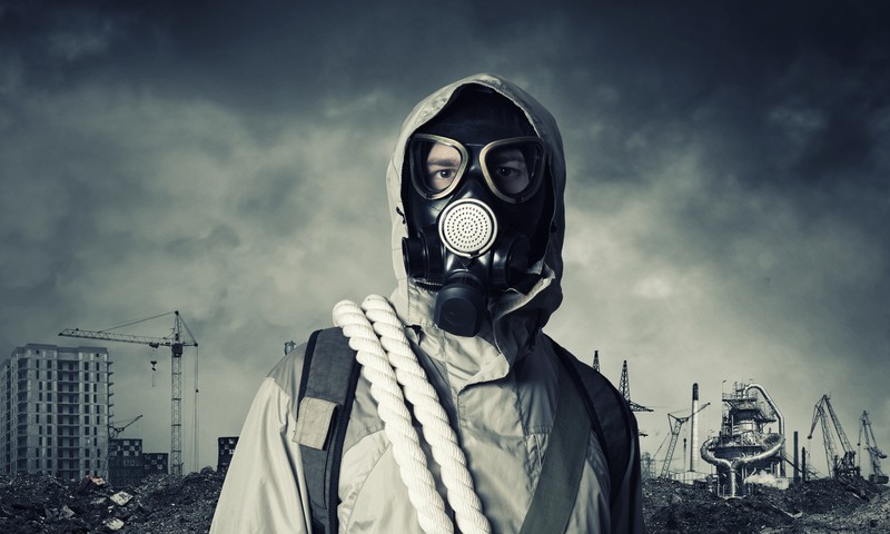 prepper-with-gas-mask-and-supplies
