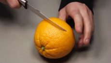 cutting an orange