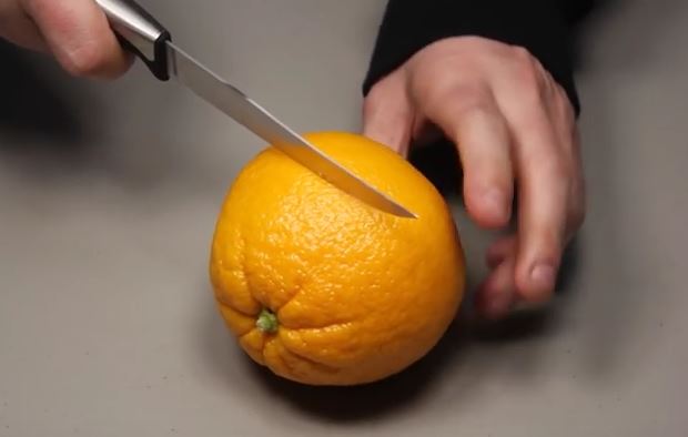 cutting an orange