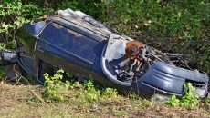 wrecked-car-on-the-side-of-the-road