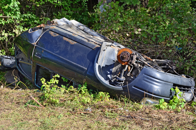 wrecked-car-on-the-side-of-the-road