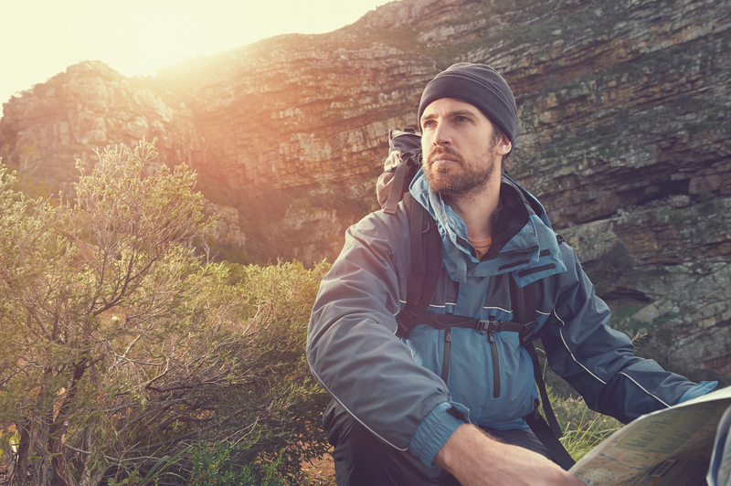 man in wilderness with map