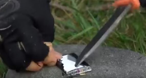 cutting into a battery