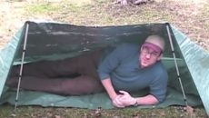 guy in tarp tent