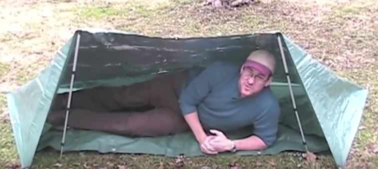 guy in tarp tent