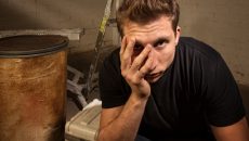 unhappy man sitting