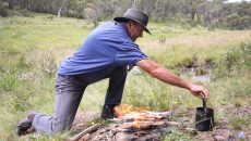 man making a campfire