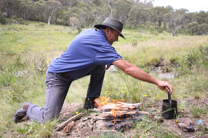 man making a campfire