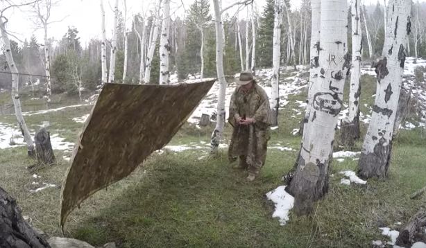 man setting up tarp