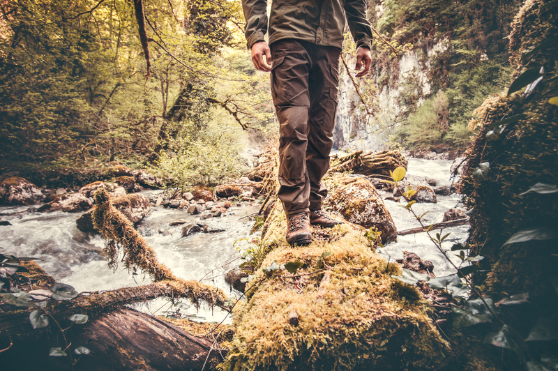 man walking across river