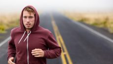 man running on trail in nature