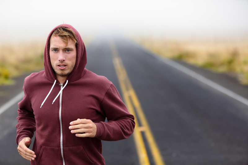 man running on trail in nature