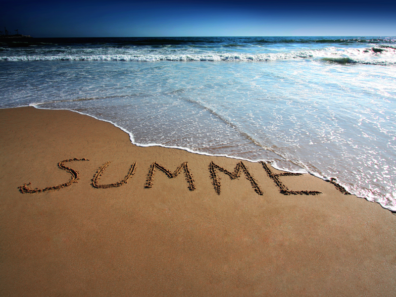 summer written in the sand beach
