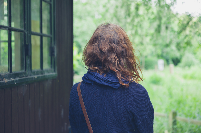 woman at cabin in the woods