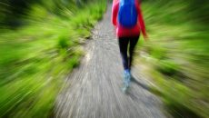 blurred woman hiking in wild