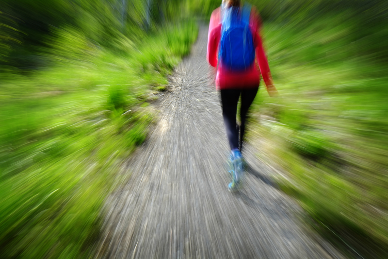 blurred woman hiking in wild