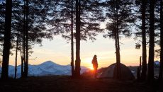 man at sunset camping